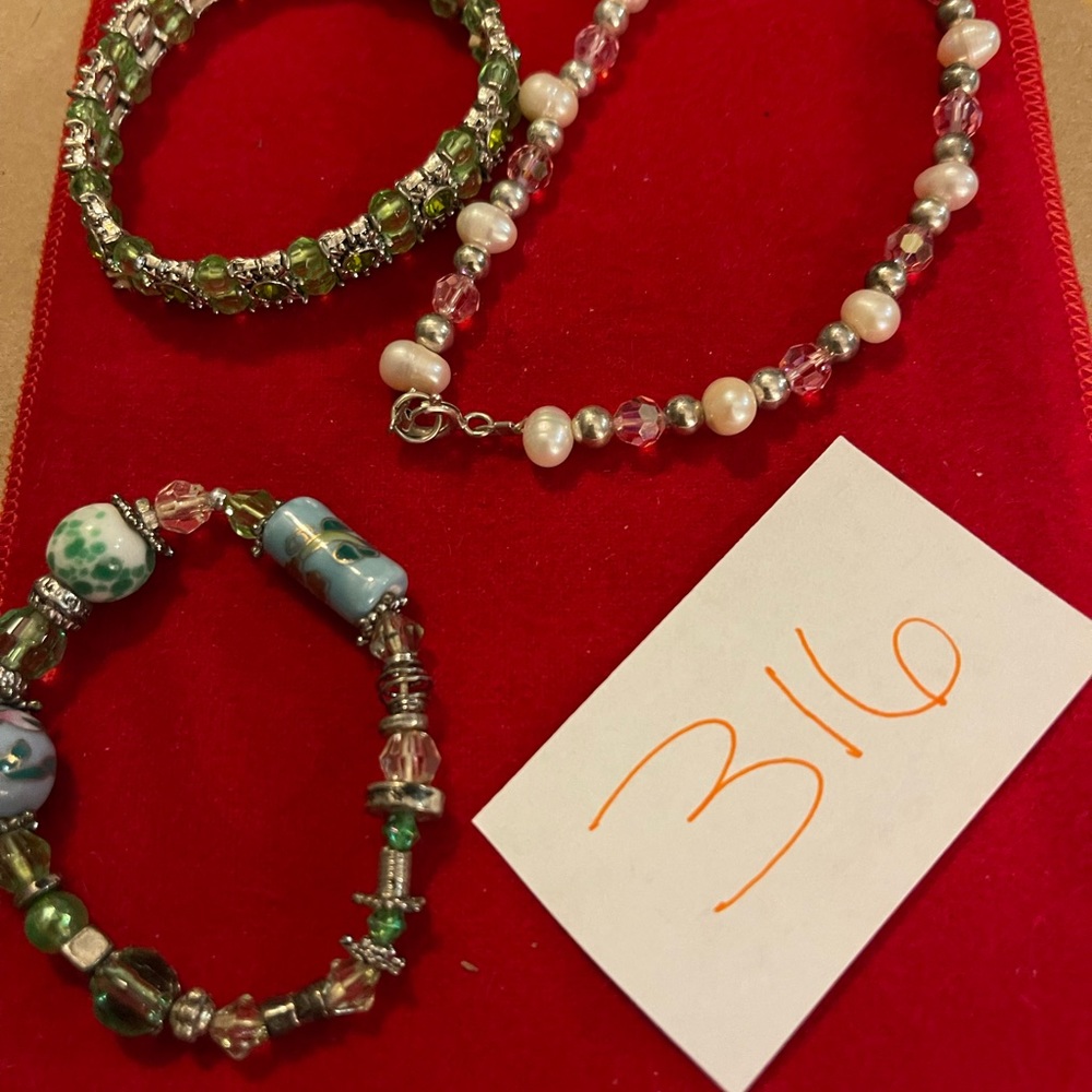 14 bracelets. Sold together